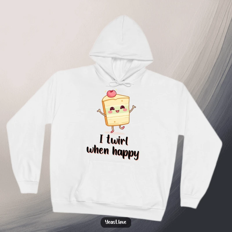 Funny cake slice hoodie featuring a happy dessert character in a delightful twirl. Cozy and humorous outerwear.
