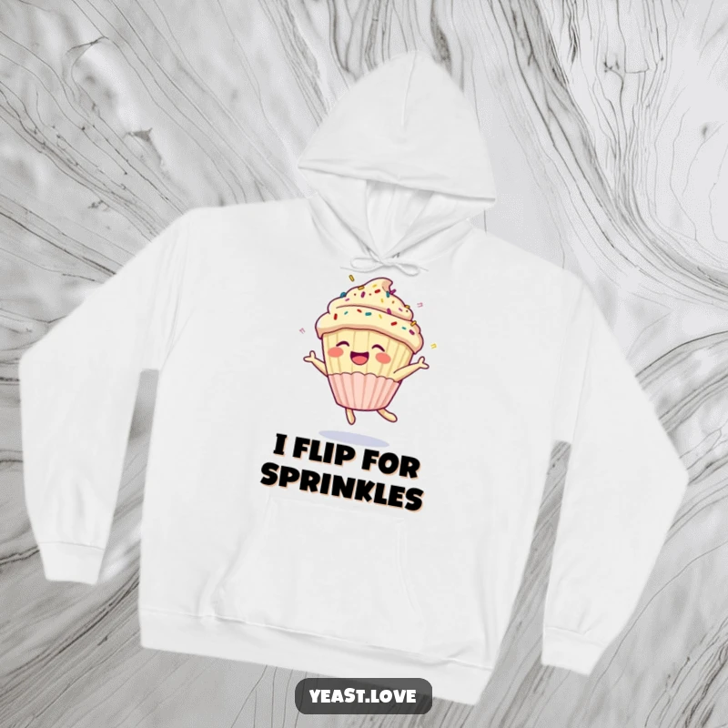 Funny cupcake hoodie design featuring a happy dessert character with sprinkles doing a joyful somersault. A warm and humorous clothing item.
