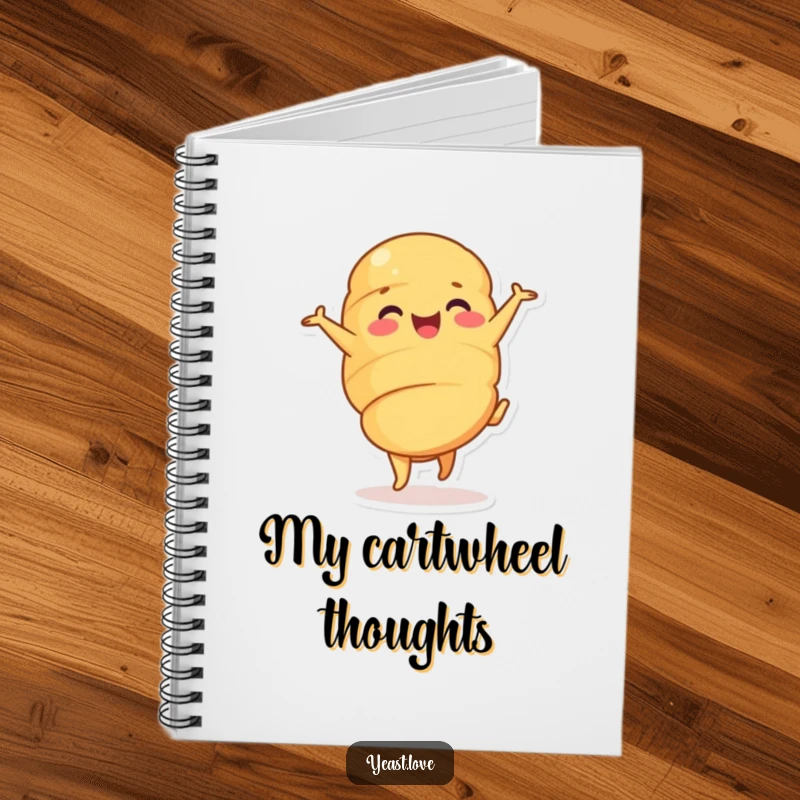 Funny croissant notebook with a happy pastry character in a cheerful cartwheel. Ideal for notes and creative ideas.